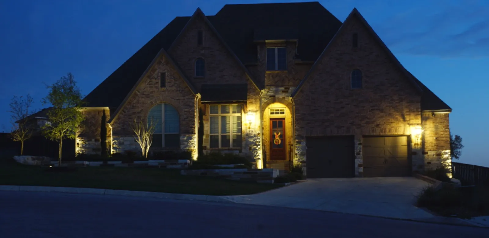 LED landscape and architectural lighting on a Texas home at night