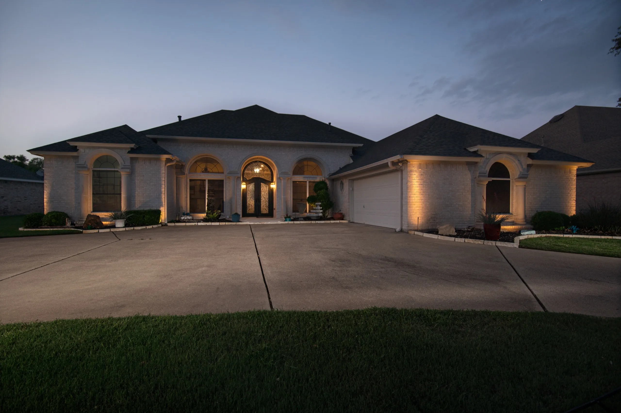 LED landscape and architectural lighting on a Texas home at night